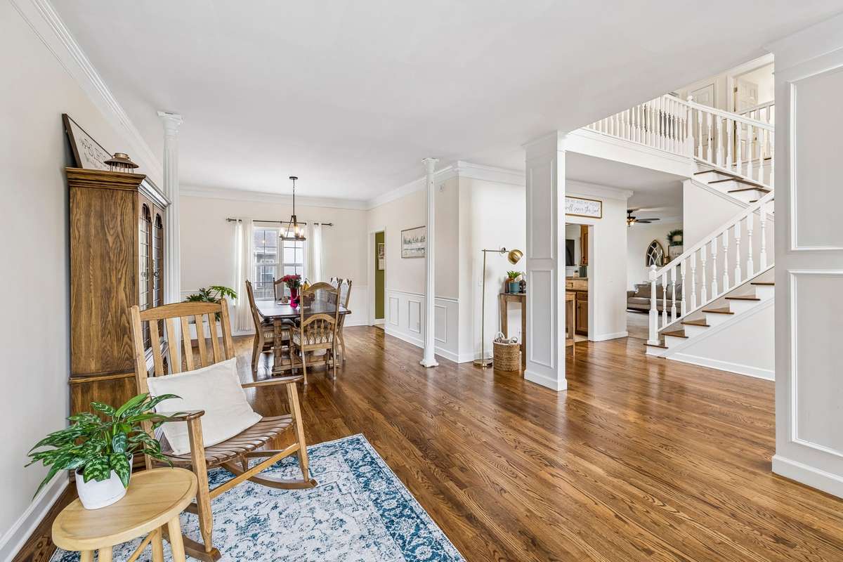 A welcoming open space features rich hardwood floors, classic wainscoting, and elegant columns! 1407 Ottawa Place, Murfreesboro, TN 37129