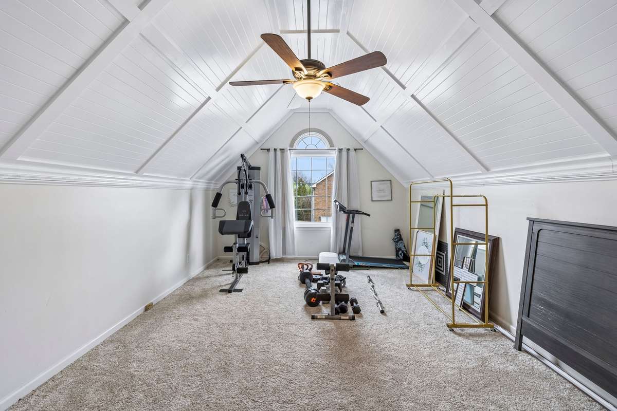 Oversized bonus room featuring a stunning vaulted beadboard ceiling, ceiling fan, and versatile space ideal for a media room, playroom, workout area, or home office! 1407 Ottawa Place, Murfreesboro, TN 37129