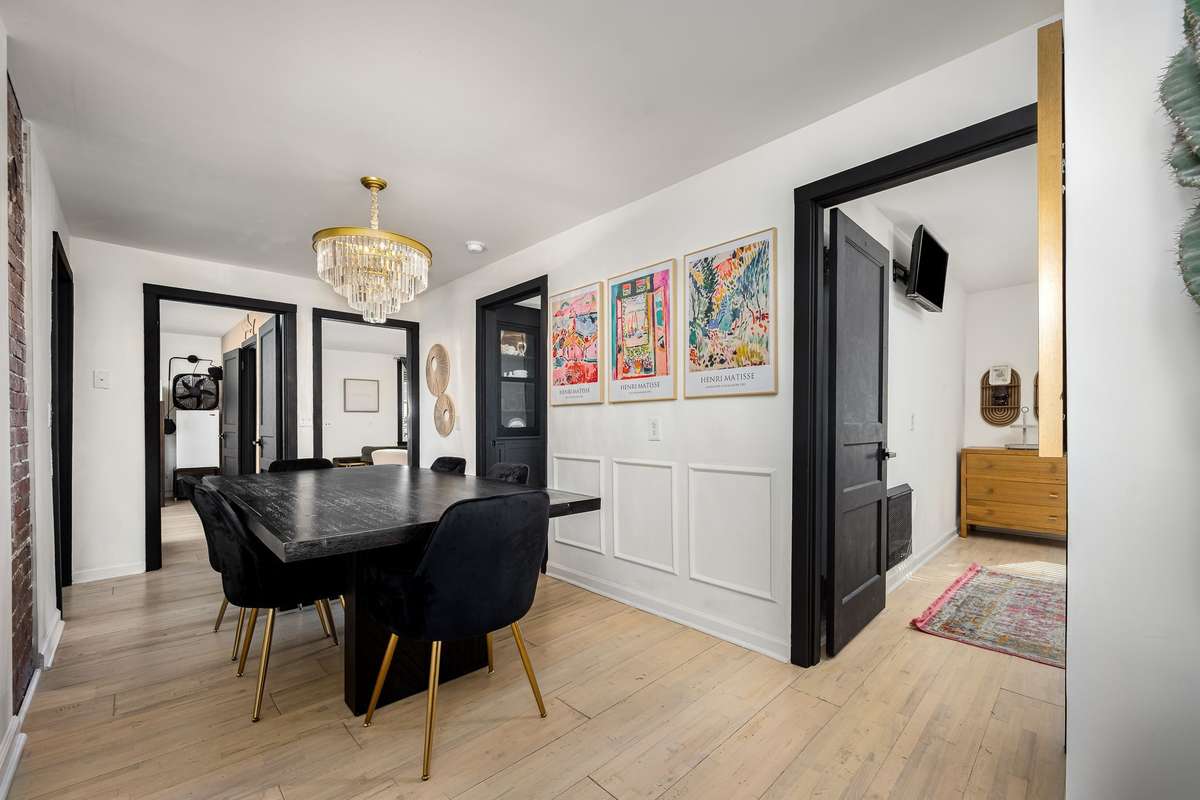 It connects all the bedrooms to the kitchen and living room.