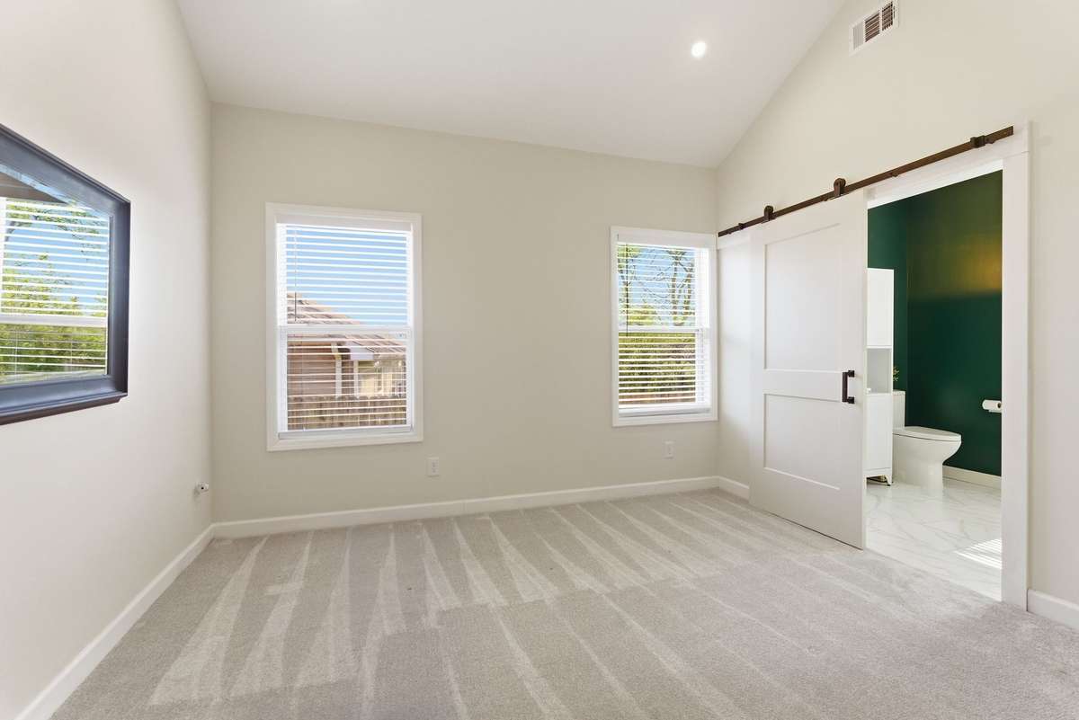 This bedroom suite is part of the new edition recently added. Making this home have two primary bathroom suites