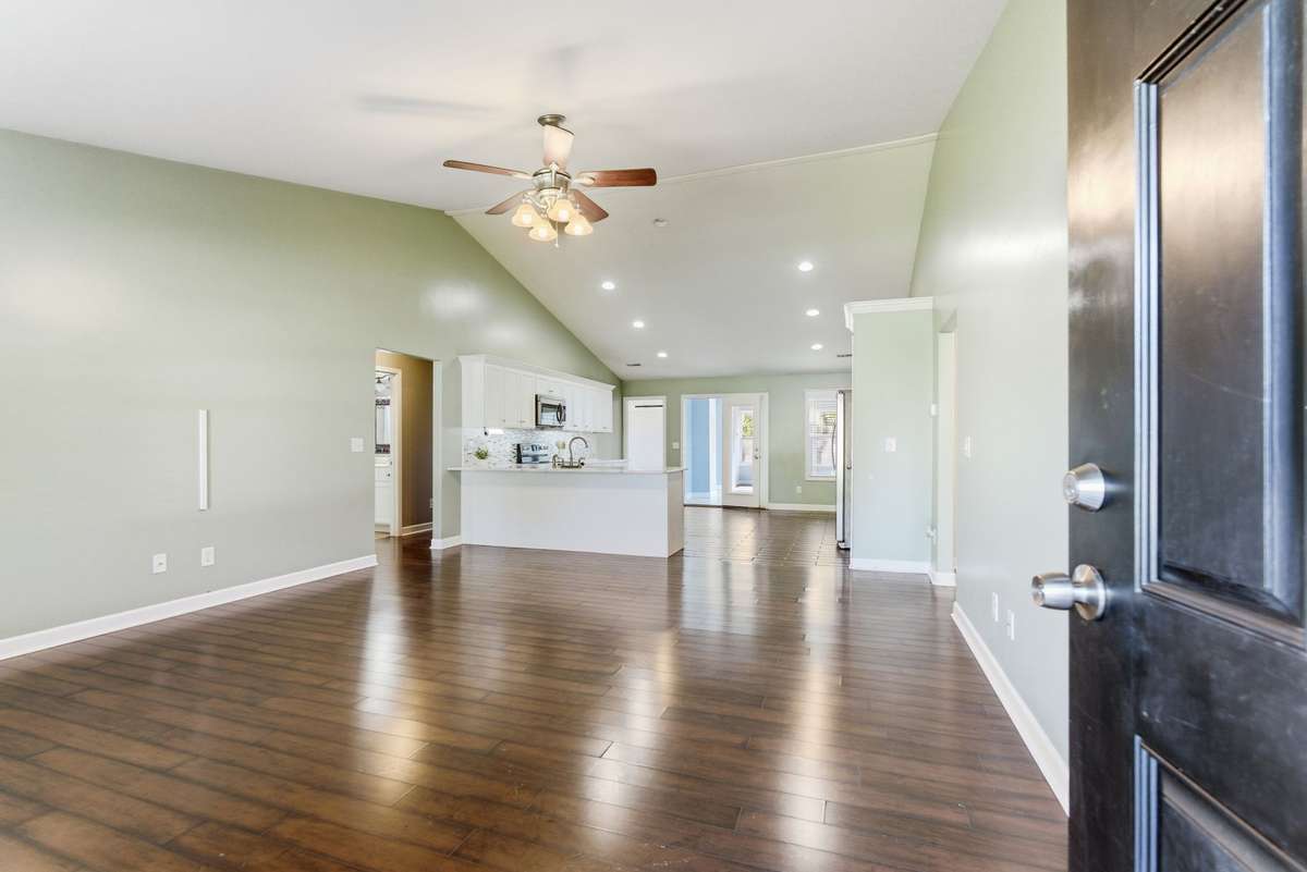 Open space living room, vaulted ceiling.