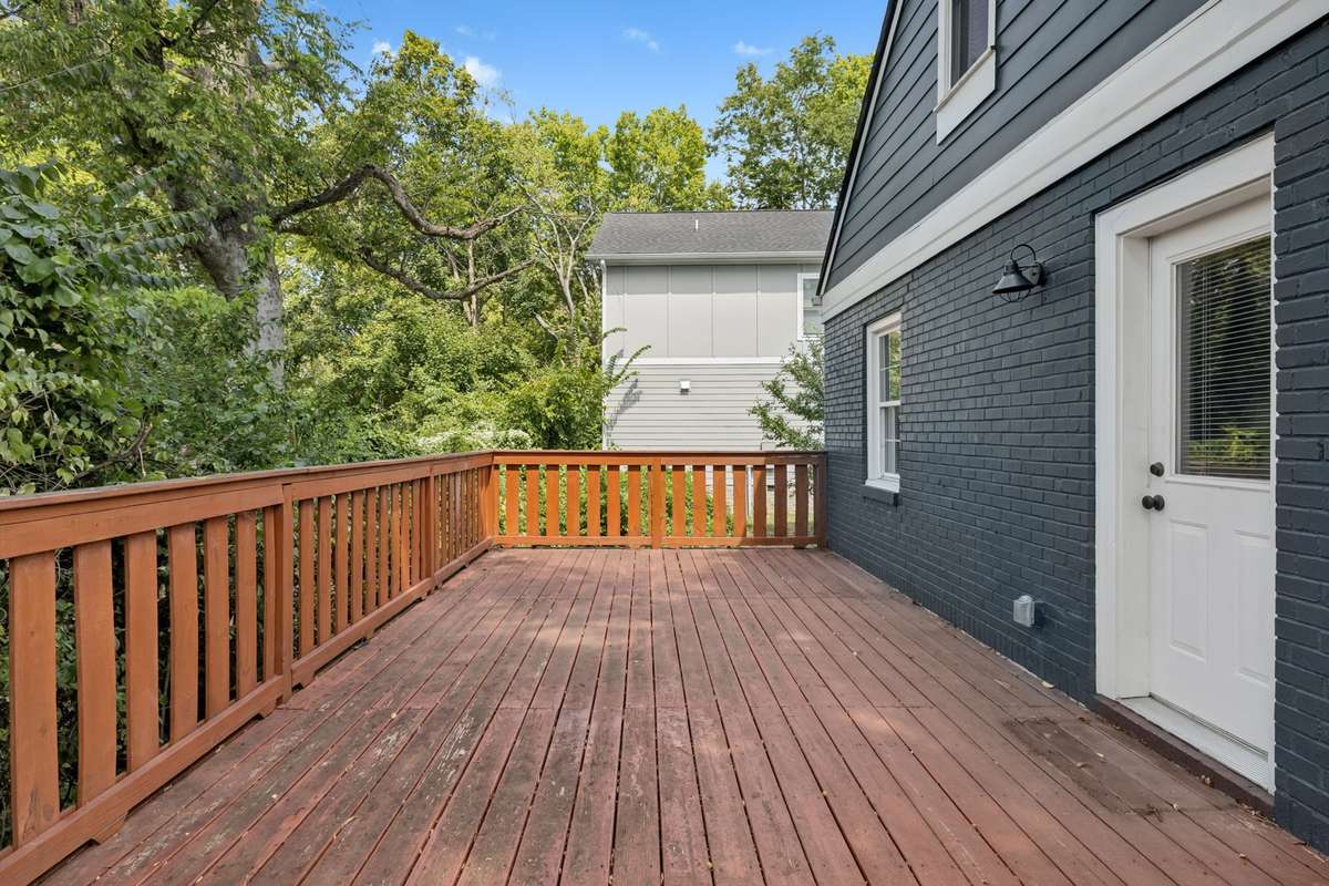 Spacious, attached deck providing plenty of room for entertaining, dining, or relaxing and enjoying the outdoors.