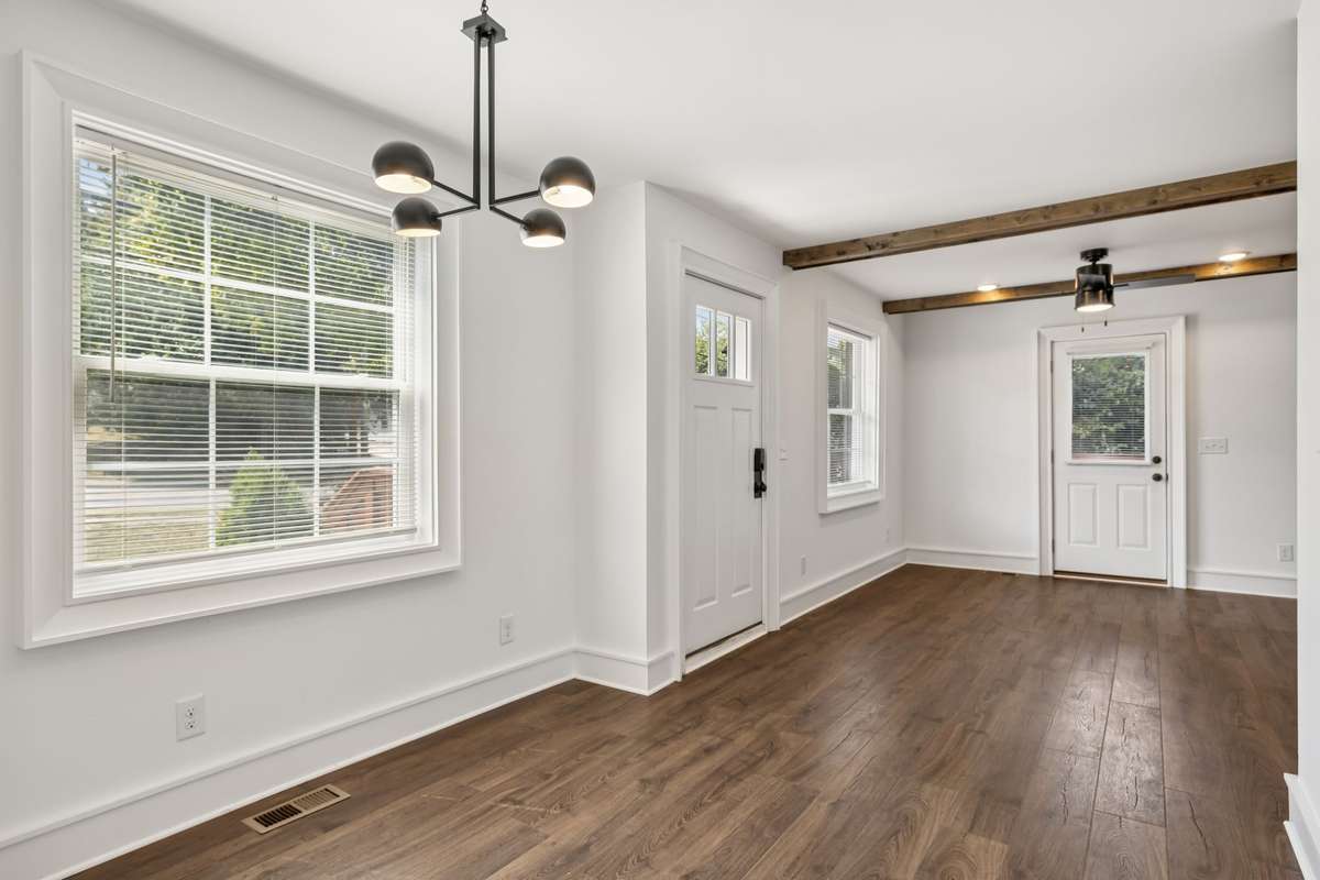Lots of windows for wonderful natural light and side door access to the outside deck.