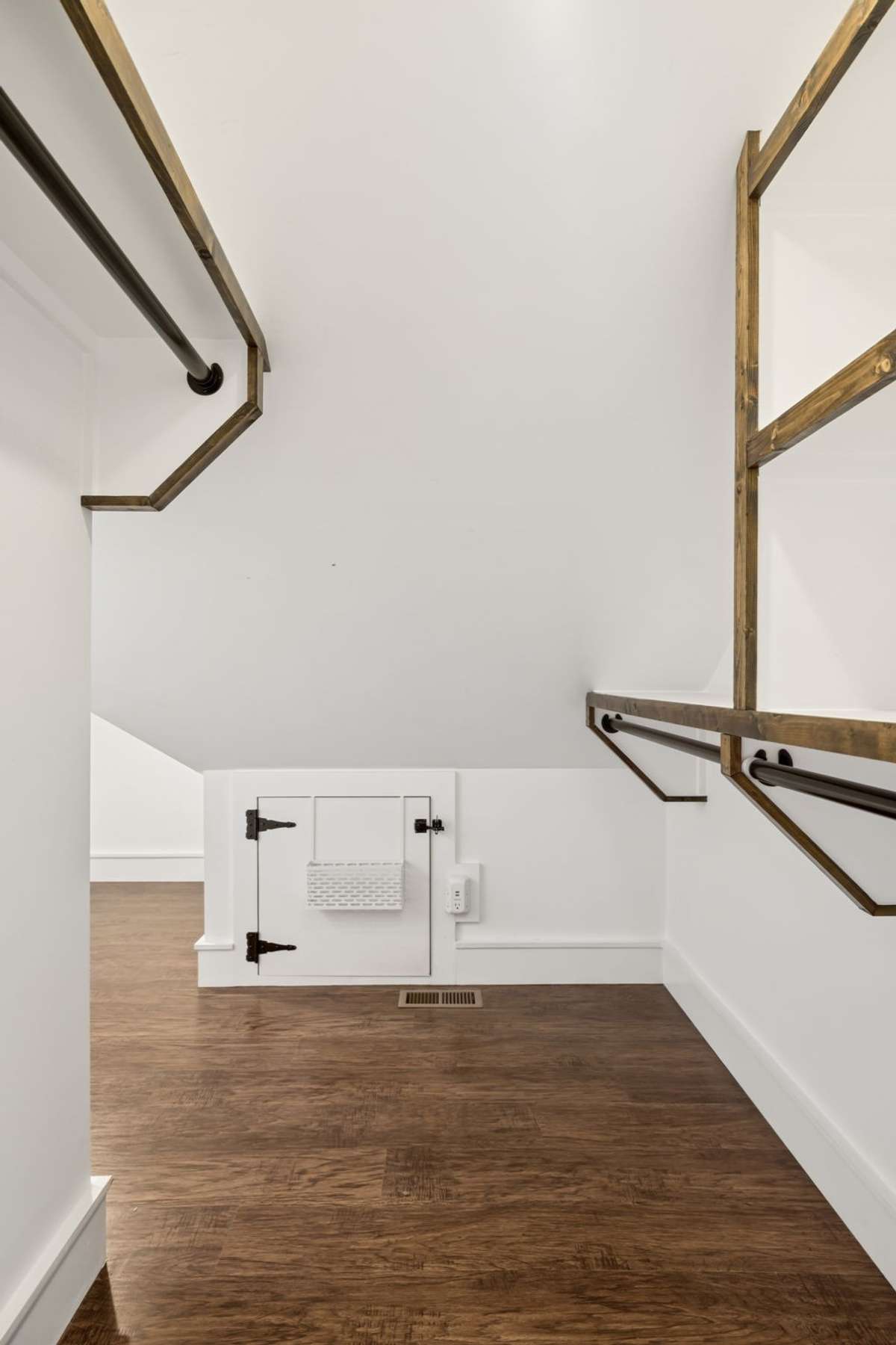 Extra large closet with lots of space around the corner.