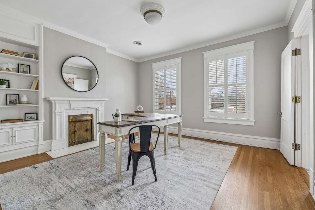 First Bedroom to the left at top of stairs with fireplace, built-ins and has adjoining "Pink" bathroom