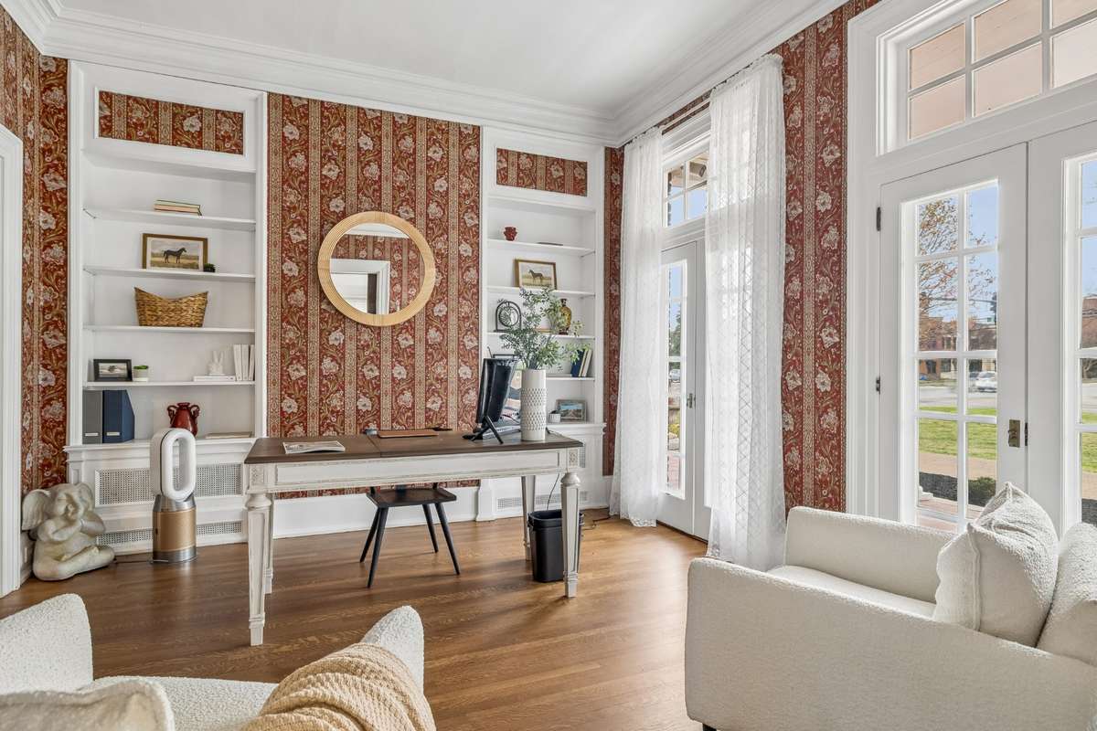 Currently the Office, the "Parlor" or Study offers timeless detail with glass doors, glass transoms, built-ins and refinished hardwoods