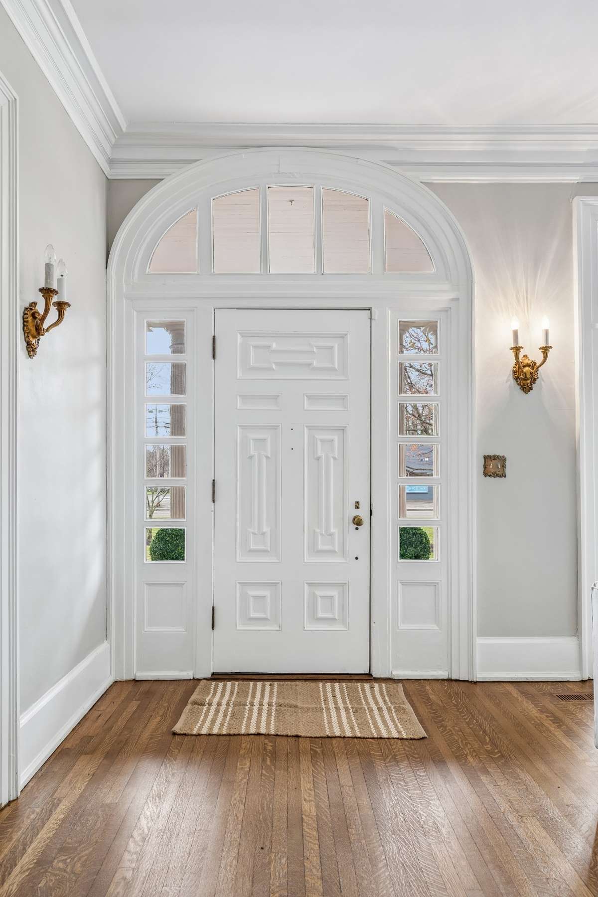 Front Foyer with curved doorframe, just one of the fabulous features of the home
