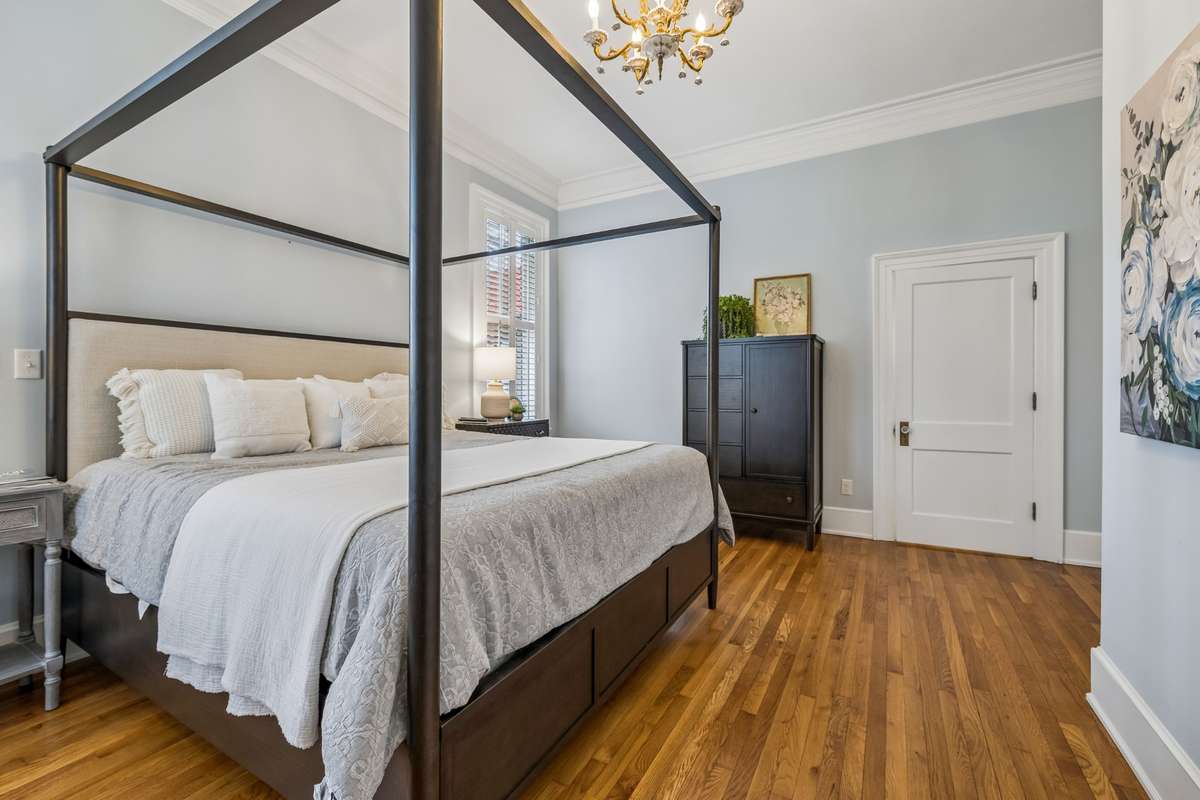 Primary Bedroom downstairs with walk-in closet and updated bathroom