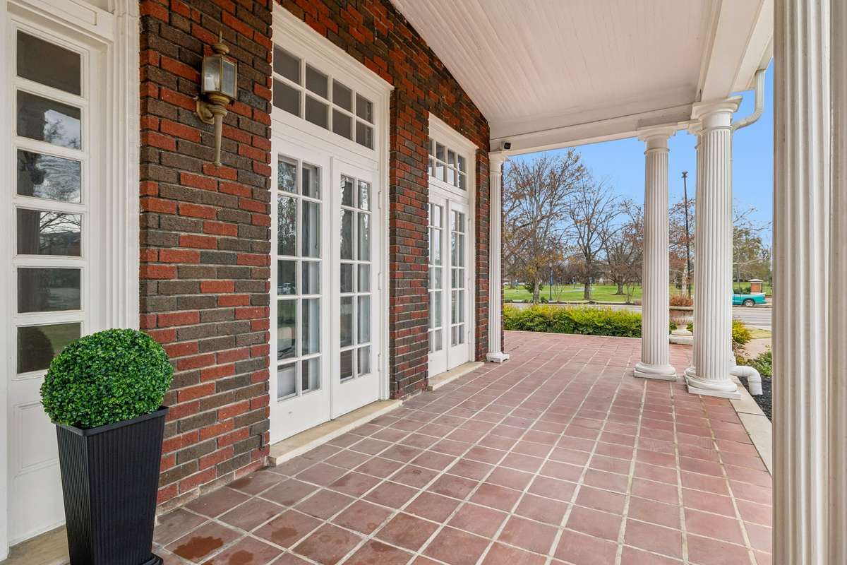 Expansive Covered Porch wraps around the right side of the home and offers a side porch and side entrance