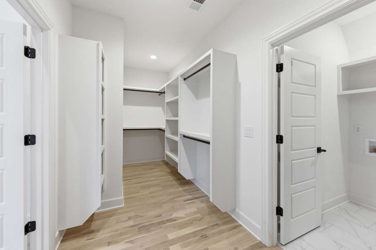 Primary closet leads directly into the laundry room. Keeping life simple