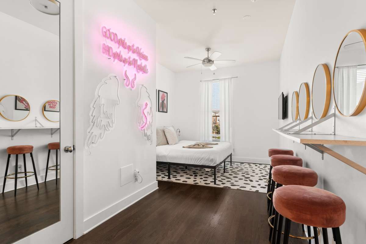 View into the spacious bedroom, separate from the living room and kitchen areas.