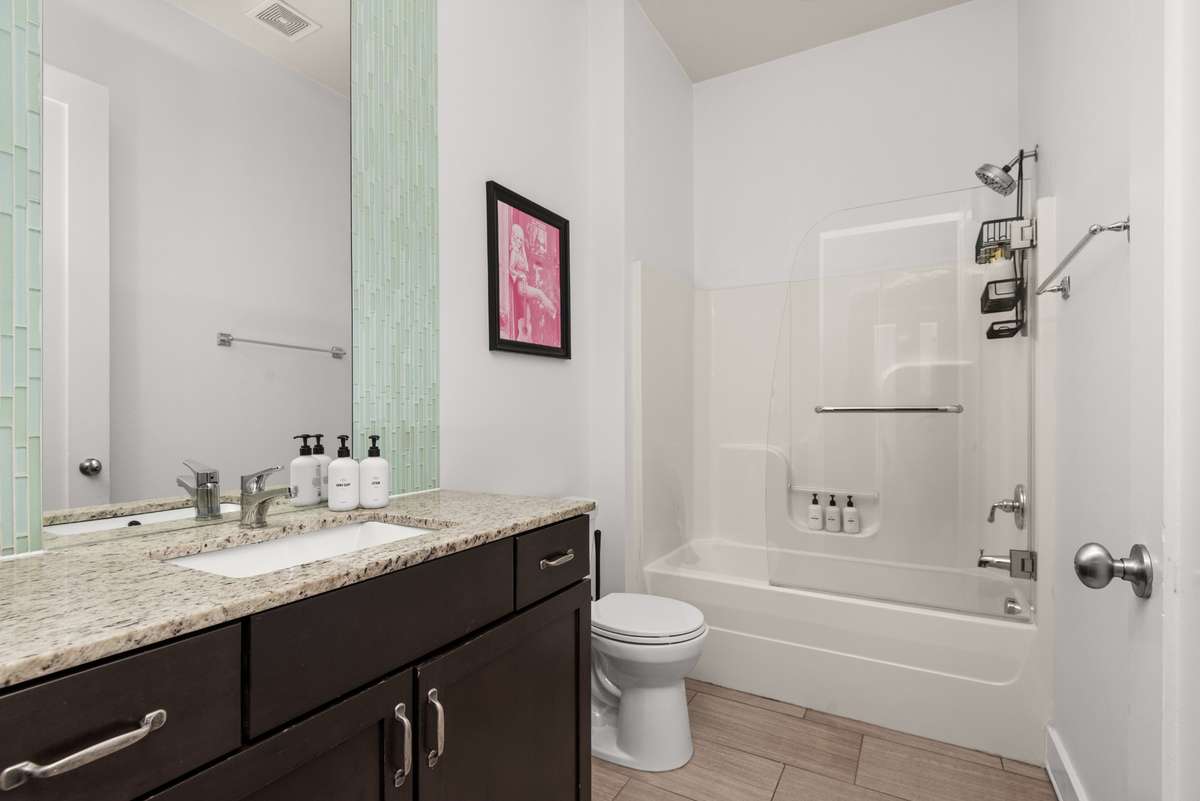 This spacious bathroom has everything you need.
