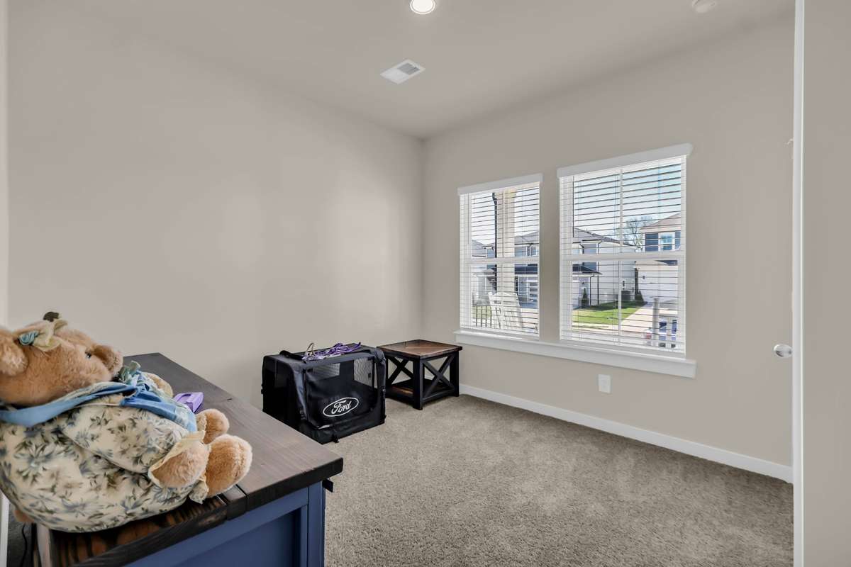 Bedroom 3 with a window to the front porch