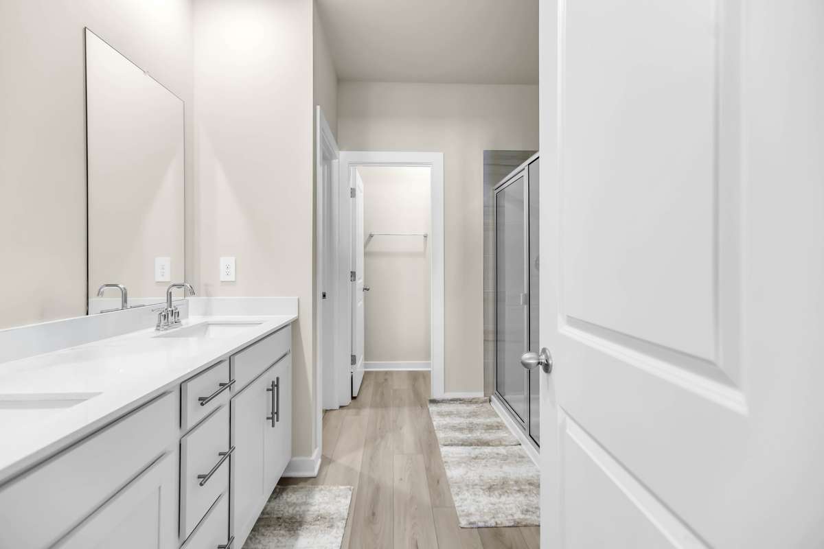 Large primary en suite bath with walk in shower and water closet