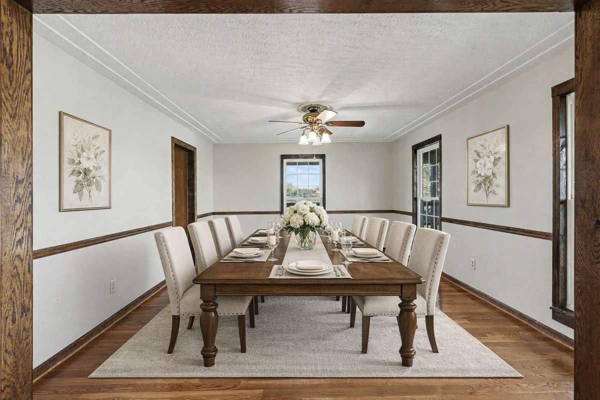 A Bright And Elegant Formal Dining Room With Gleaming Hardwood Floors Overlooking The Beautiful Wraparound Porch *Virtually Staged