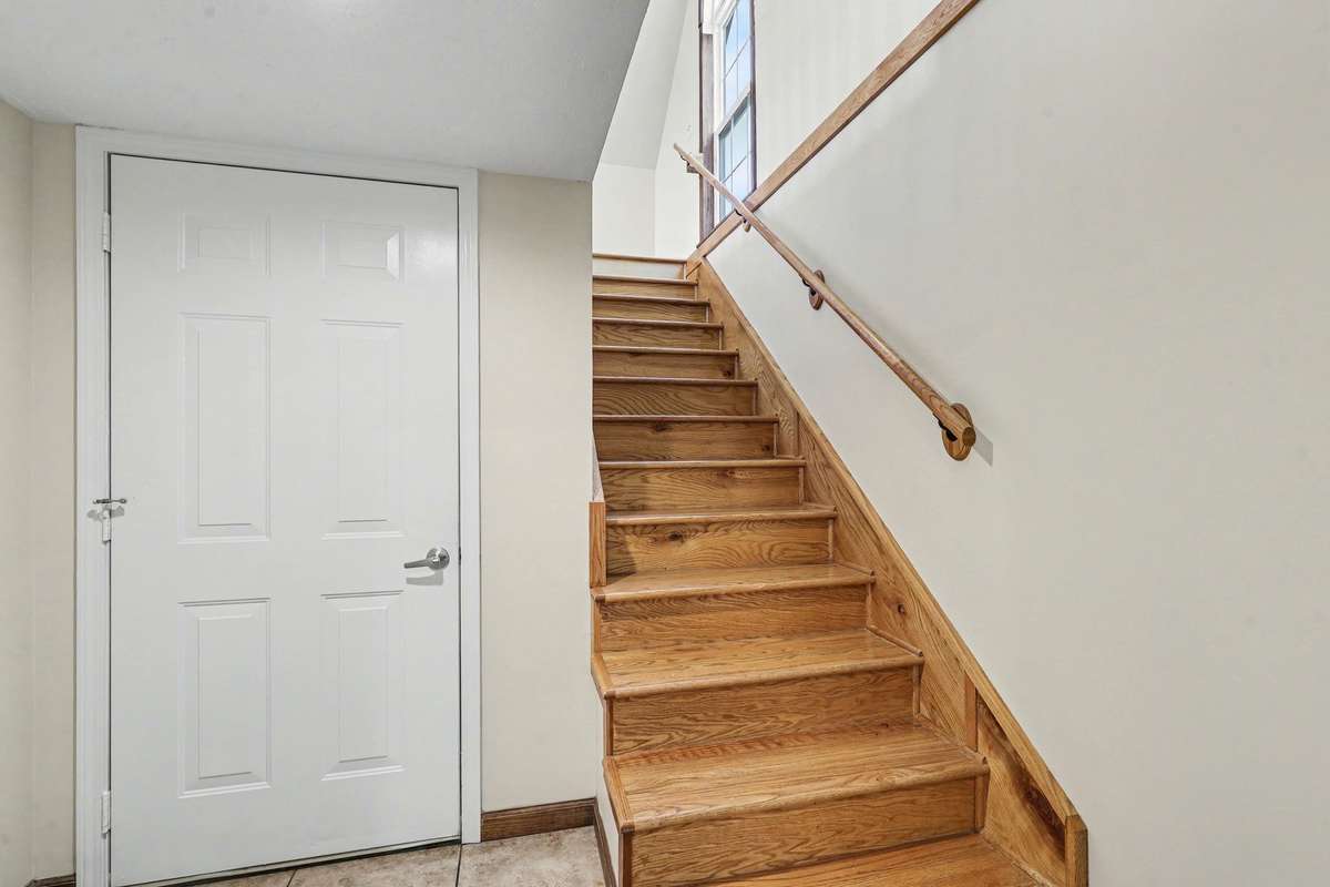 Private Staircase Leading To The Bonus Room Above The Garage With Direct Garage Access