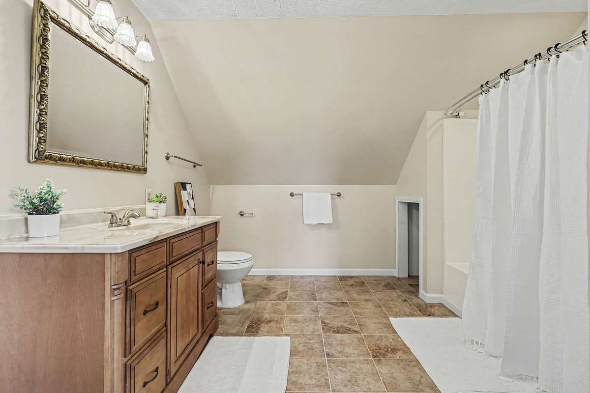 Exceptionally Large Private Full Bathroom located in Bedroom 2 With a Spacious Vanity And Tub/Shower Combo