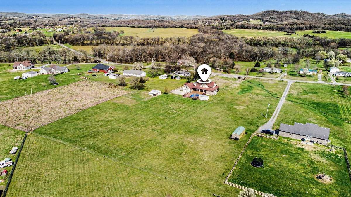 The property offers wide, gently rolling fields with ample room for a variety of uses, whether you envision a hobby farm, recreational retreat, or simply enjoying the tranquility of wide-open space.