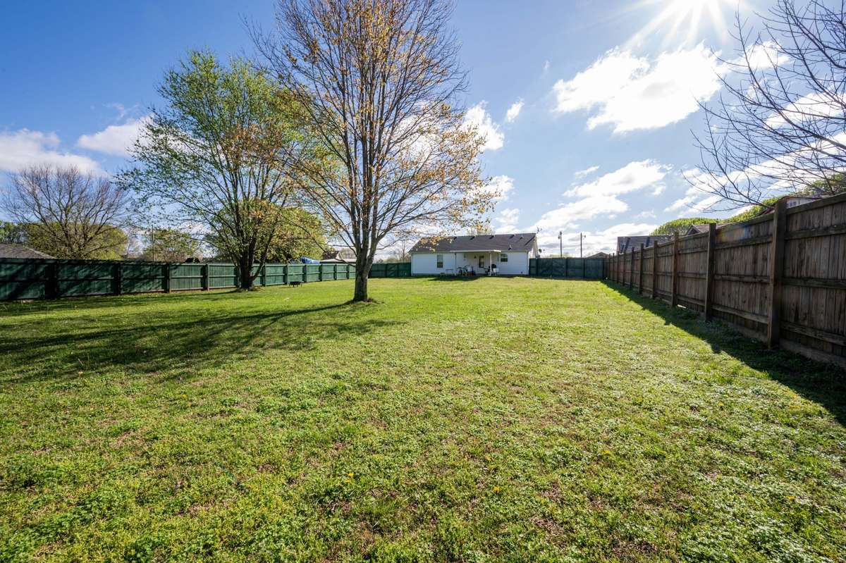 Large fenced in back yard with Mature trees!!