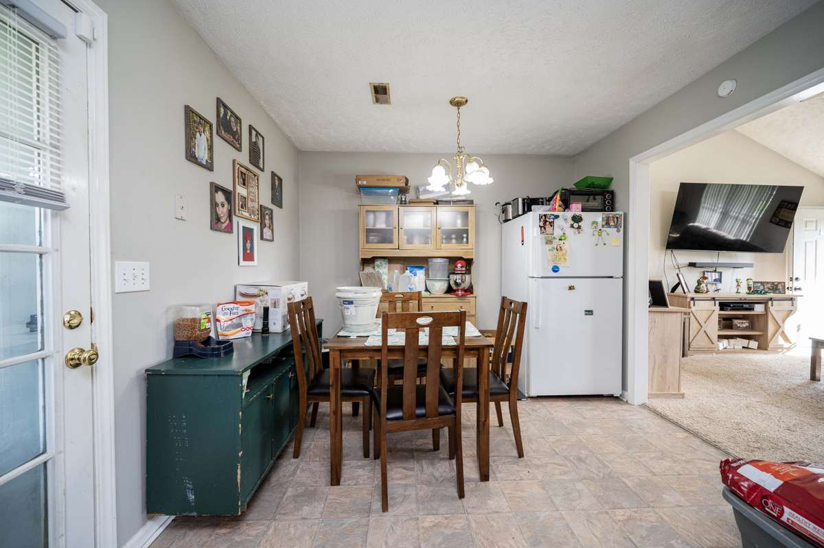 Dining Room!!  White Refrigerator stays with the home.