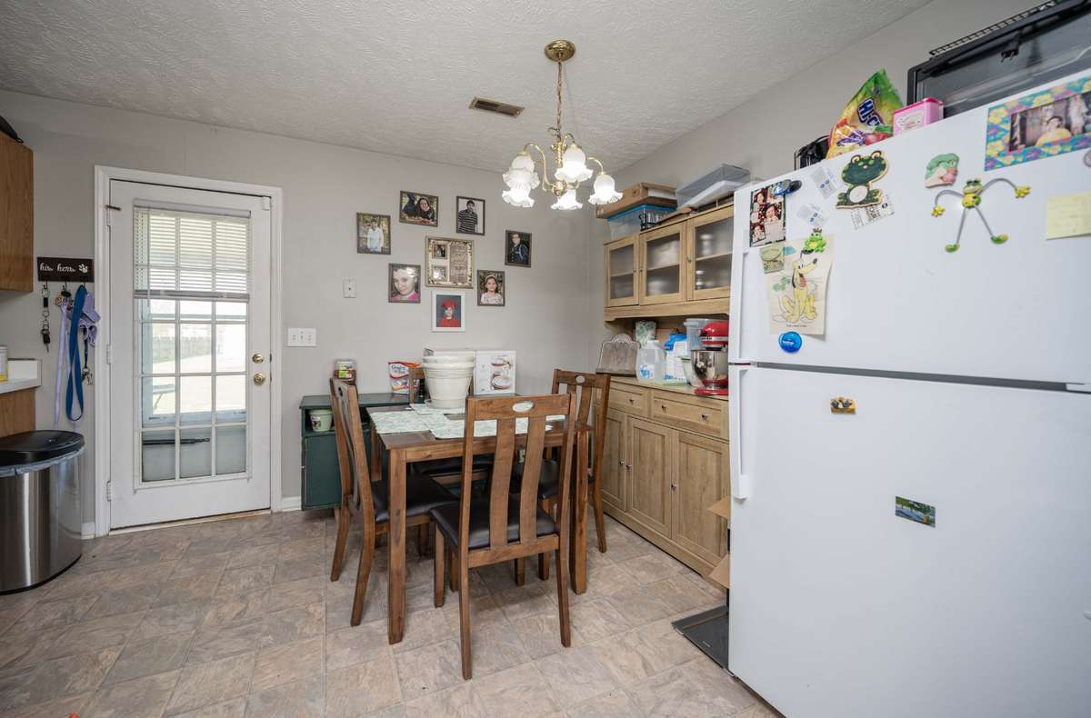 Dining Room!!  White Refrigerator stays with the home.