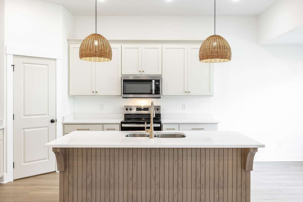 Custom cabinetry throughout, quartz countertops and designer lighting