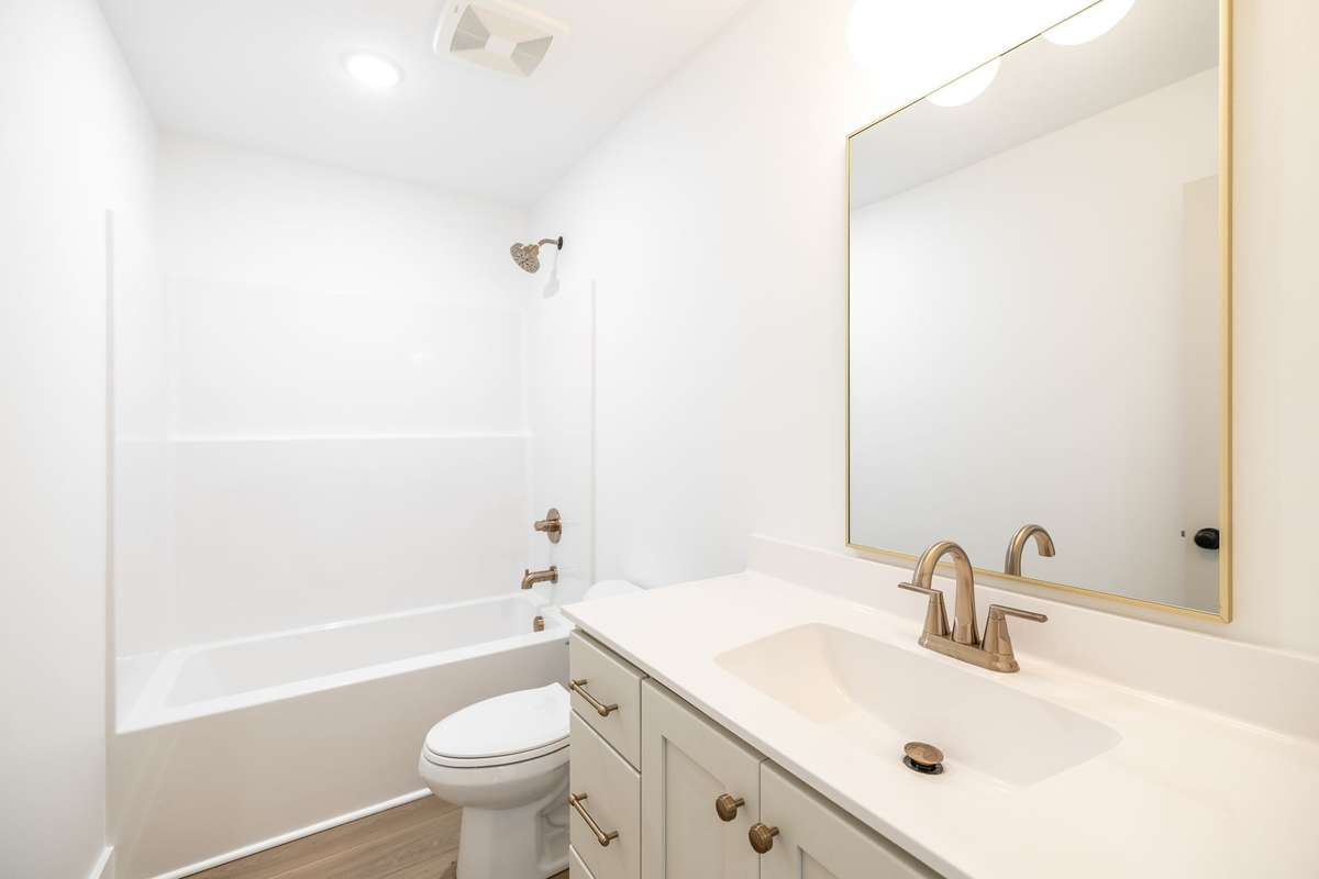 Bath #2 also has champagne bronze fixtures and custom cabinetry~
