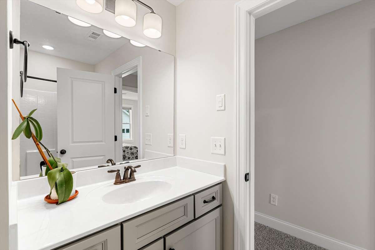 Bright vanity area with modern lighting and clean finishes