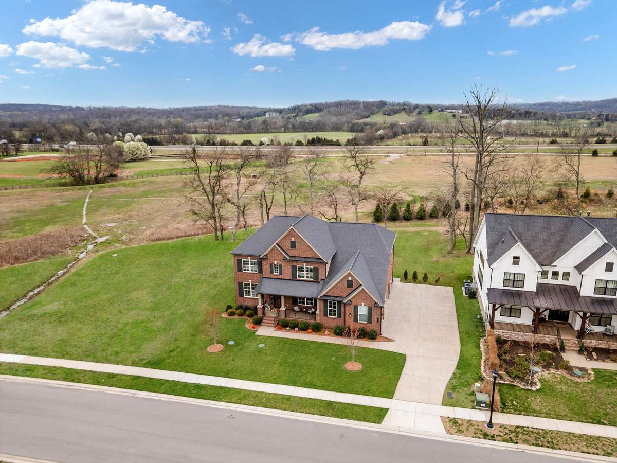 Set on a premium lot with sweeping countryside views, this home offers exceptional privacy with no immediate neighbor to the left or behind.