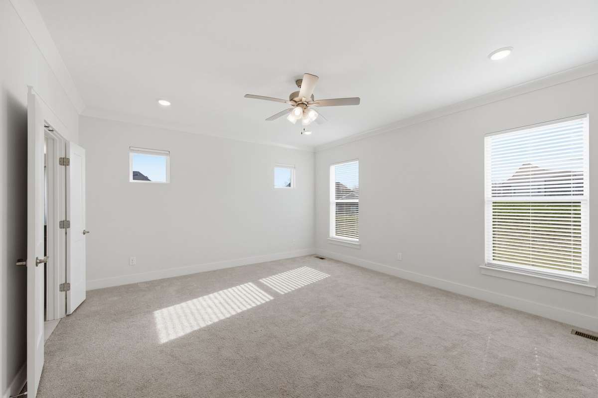 Primary bedroom overlooks the spacious backyard
