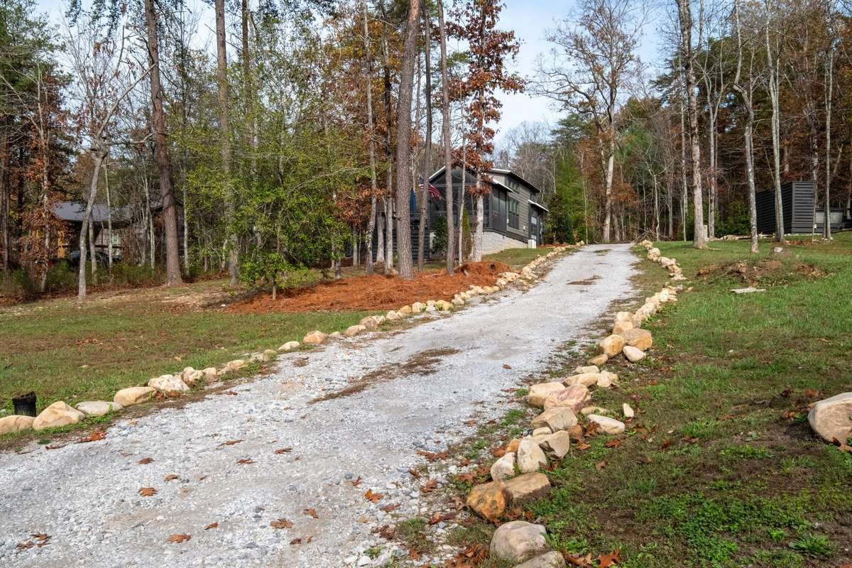 The home sits on a 0.52 acre wooded lot offering privacy and views of the lake for days!