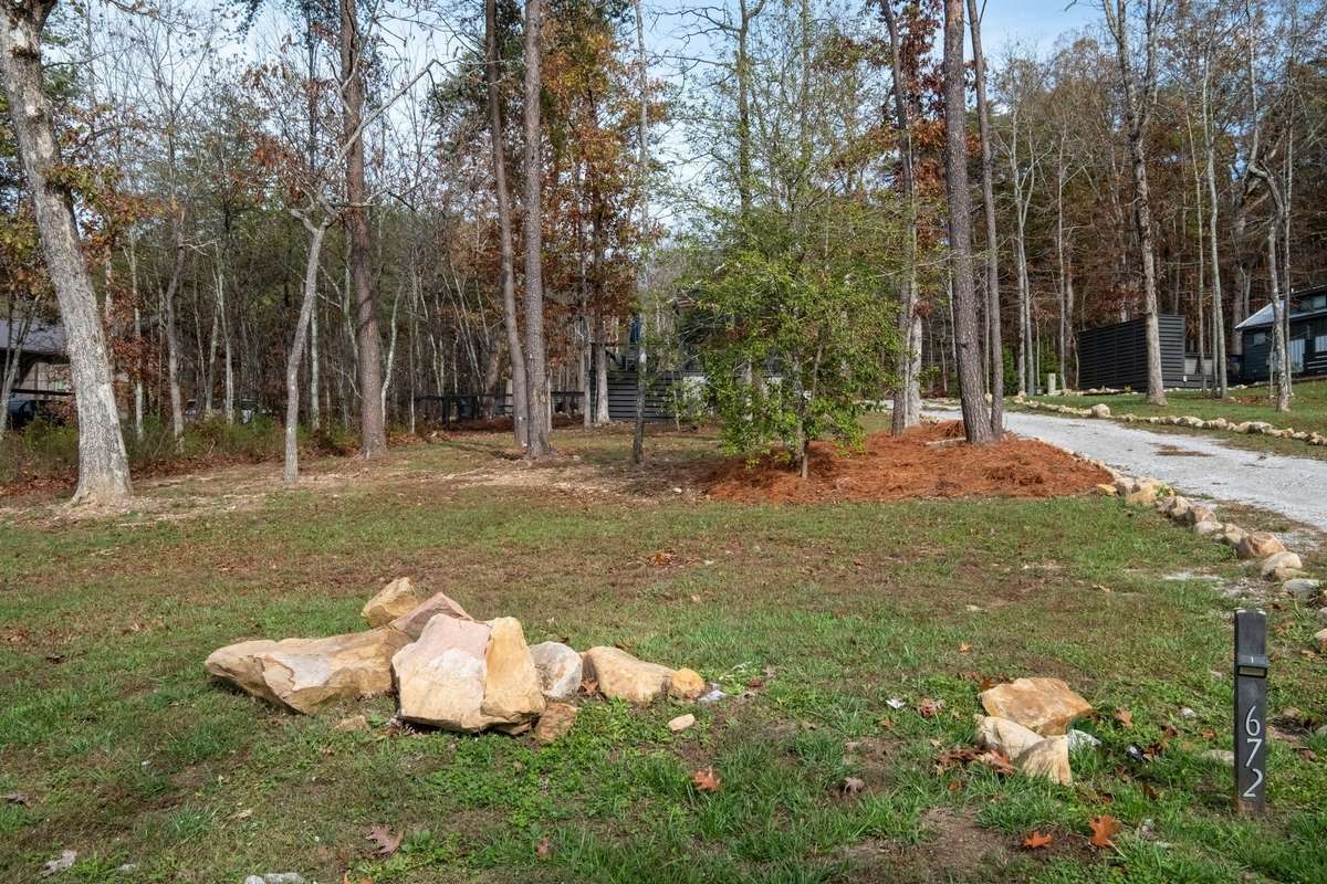 View from the street showing how private and wooded the half acre home site is
