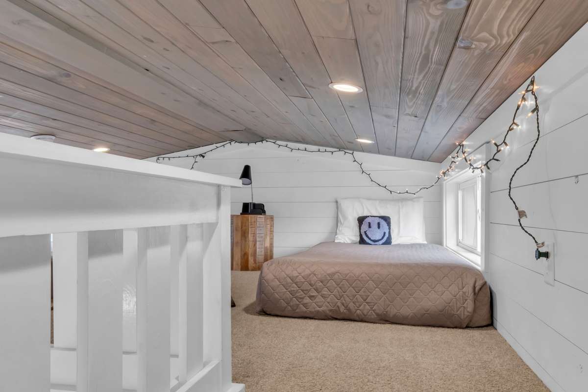 The cosy loft is carpeted and provides additional sleeping space