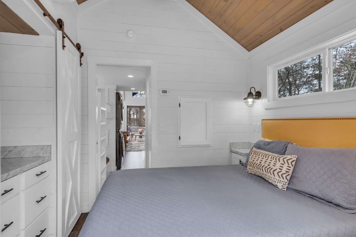 The bedroom has a pocket door for privacy and minimal space occupancy