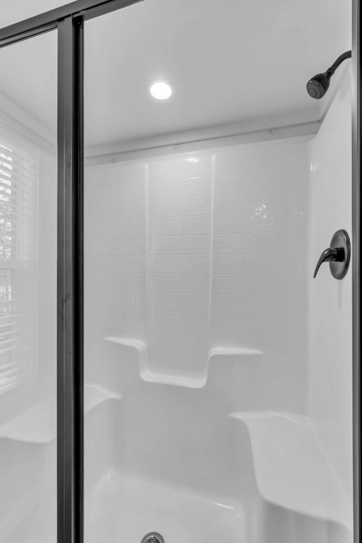 Walk-in shower with a glass door