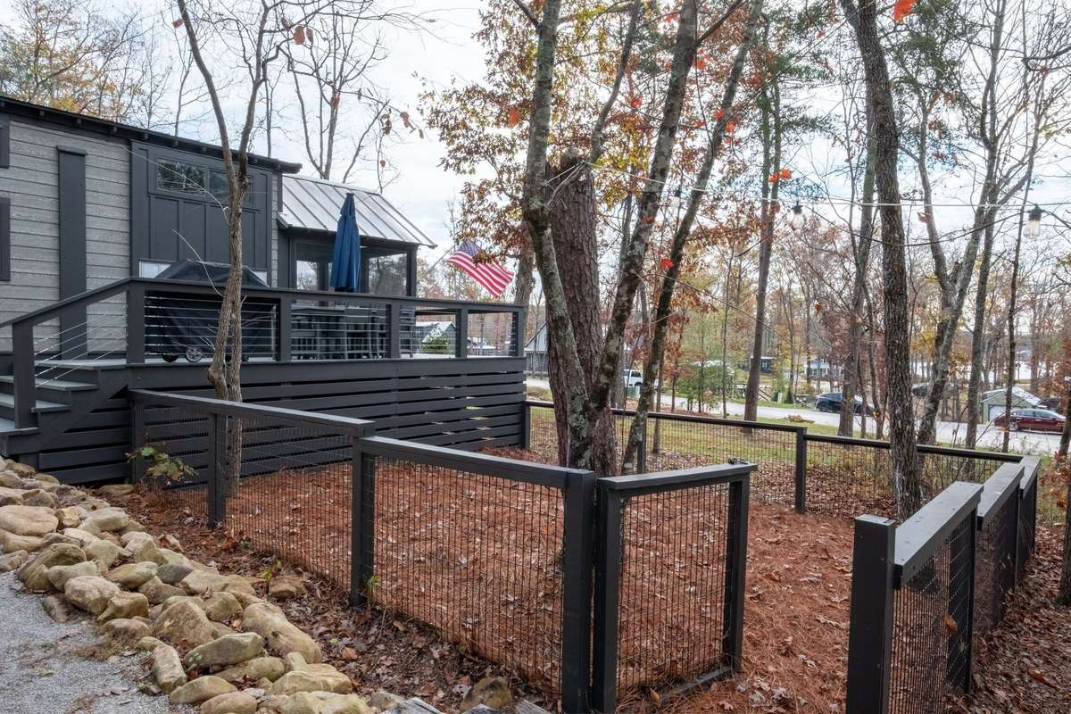Sweet fenced-in area in the yard for your fur babies!