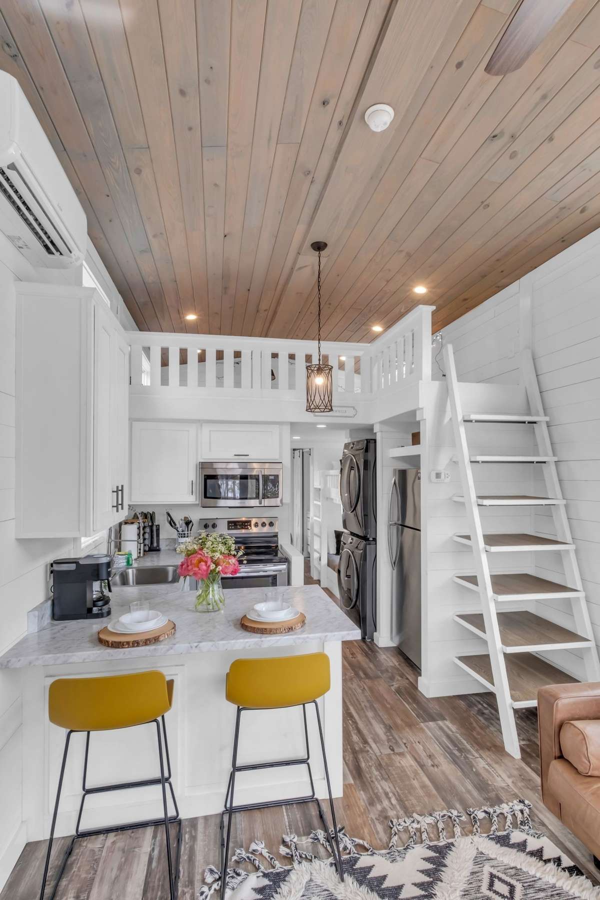 The ladder to the right provides access to the loft as well as additional space for storage and display