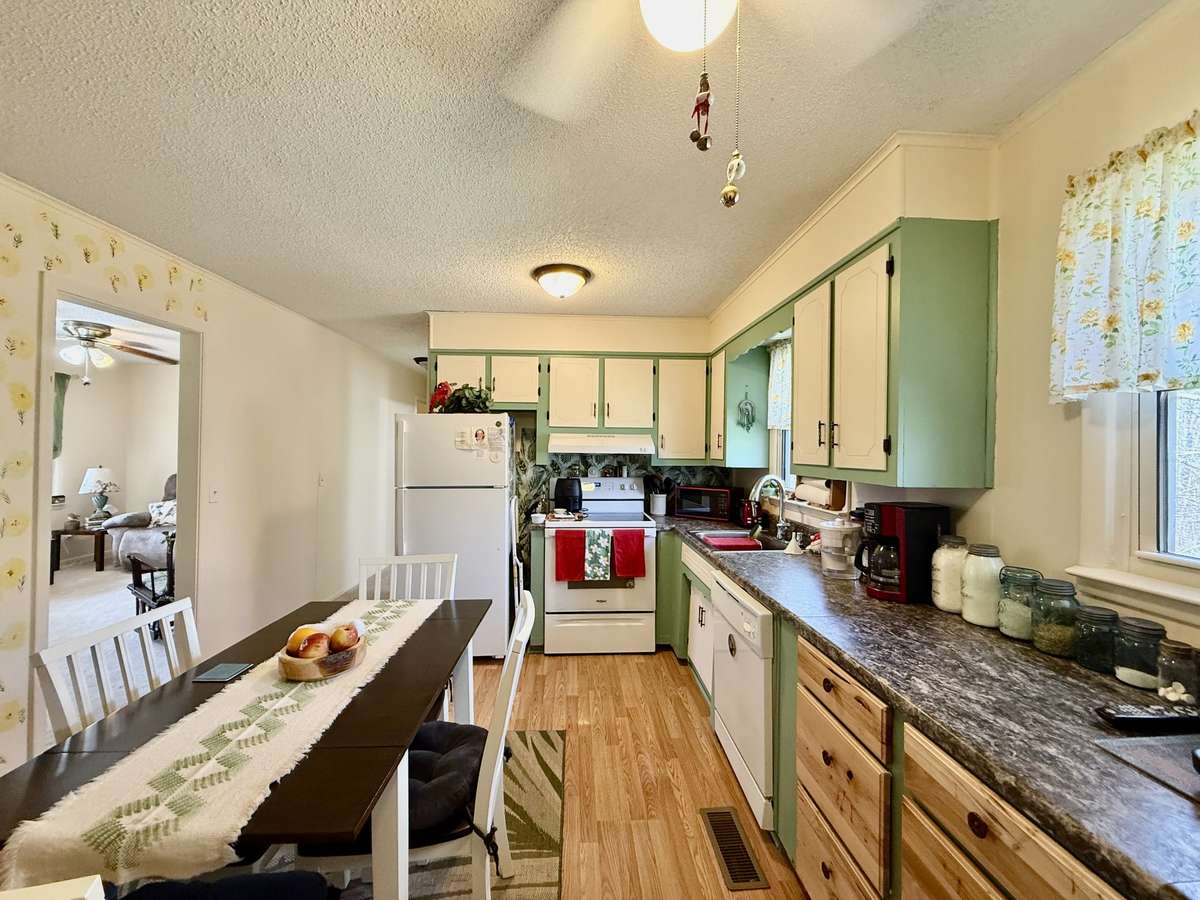Eat-in kitchen. Property comes with refrigerator, stove, and dishwasher.