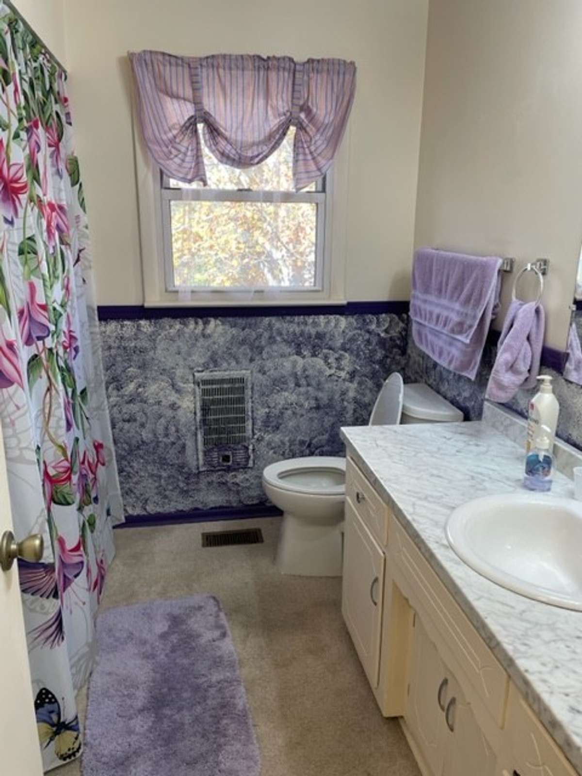 Bathroom with combo tub/shower.