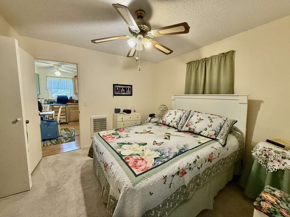 Primary bedroom right beside kitchen.