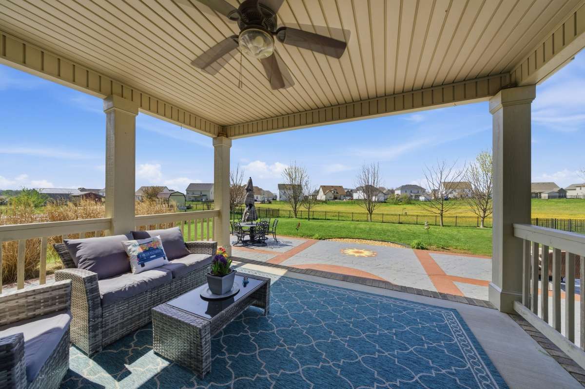 Covered patio looking out to backyard. Green space behind house. Never worry about houses being built behind the house.