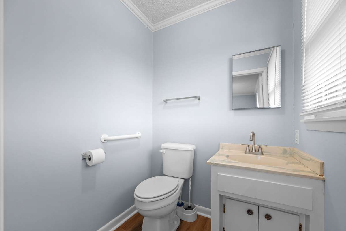 Primary bedroom with half bath