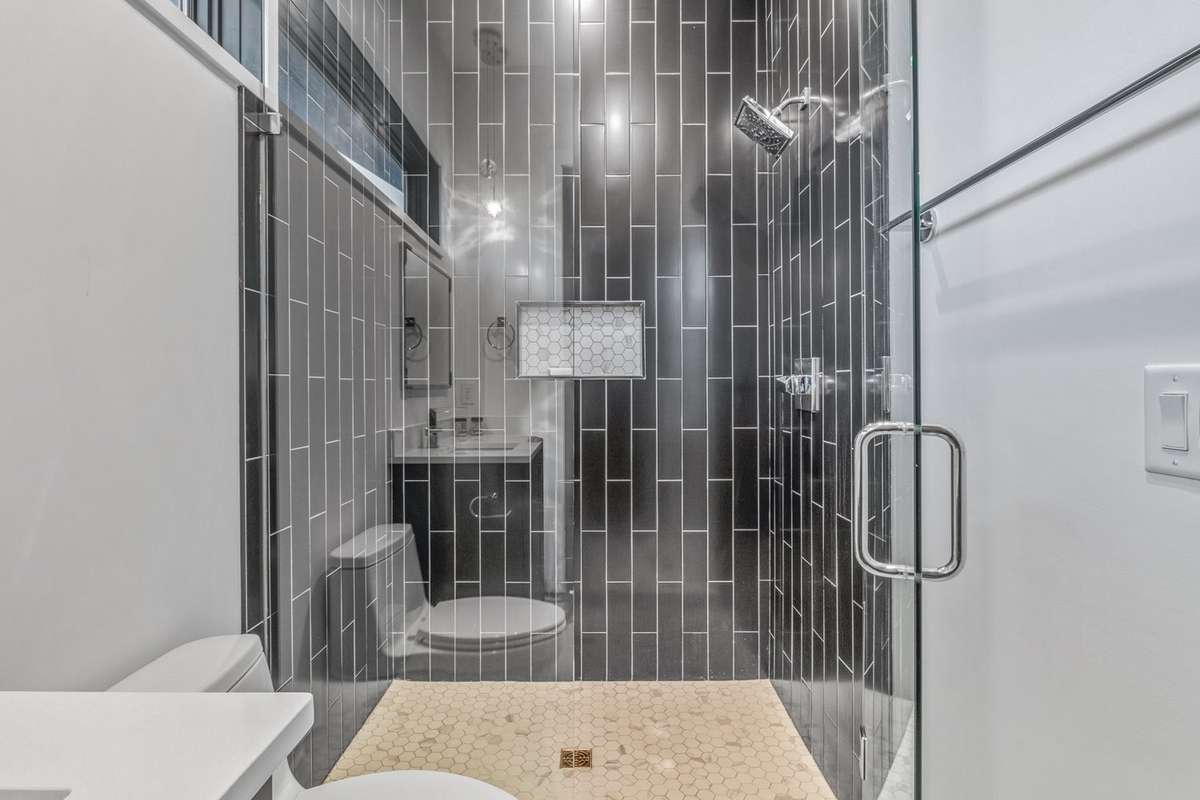 Large zero entry beautiful shower tiled to ceiling - level 3