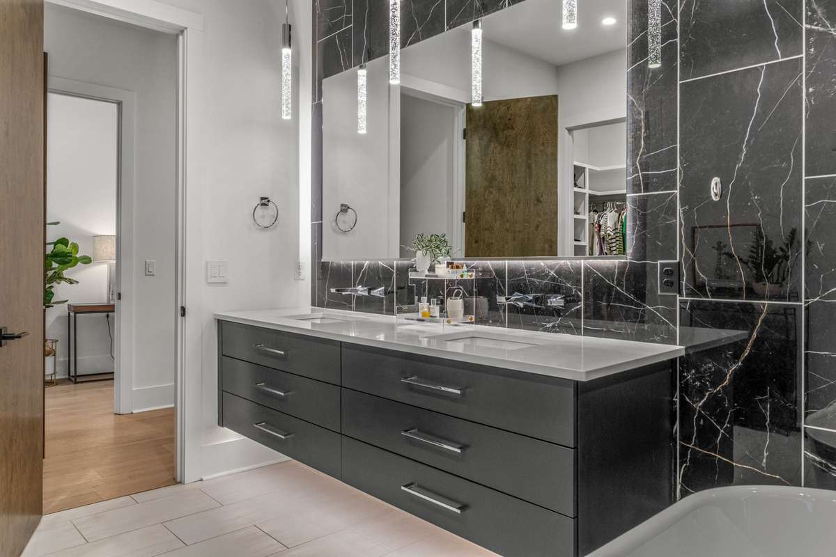 Floating double vanities with exquisite underlighting.