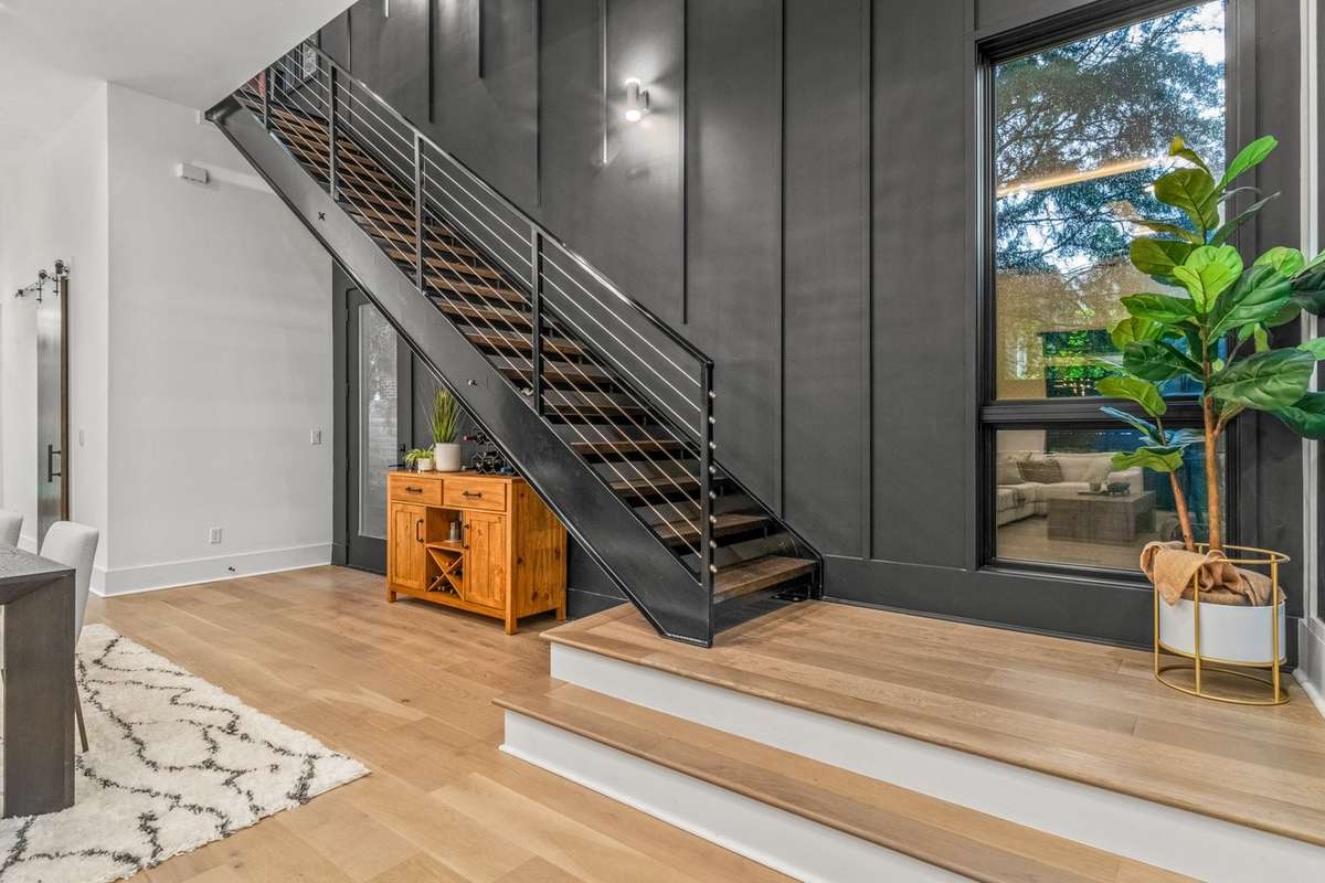 Richland Builders' signature feature wall aside the modern custom stunning staircase.