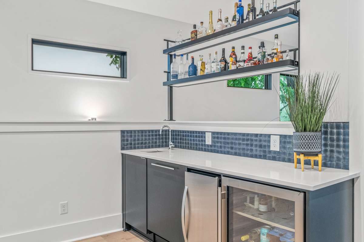 Complete wet bar with sink, dishwasher and wine fridge on level 3