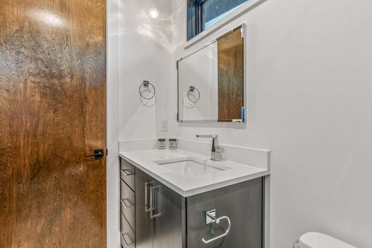 Sleek full bathroom on Level 4