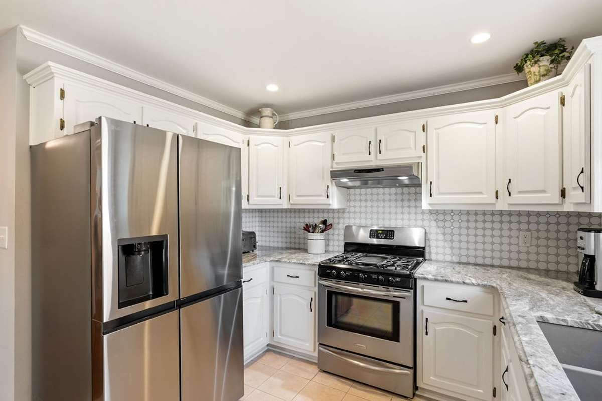 Very workable designed kitchen with stainless steel appliances.