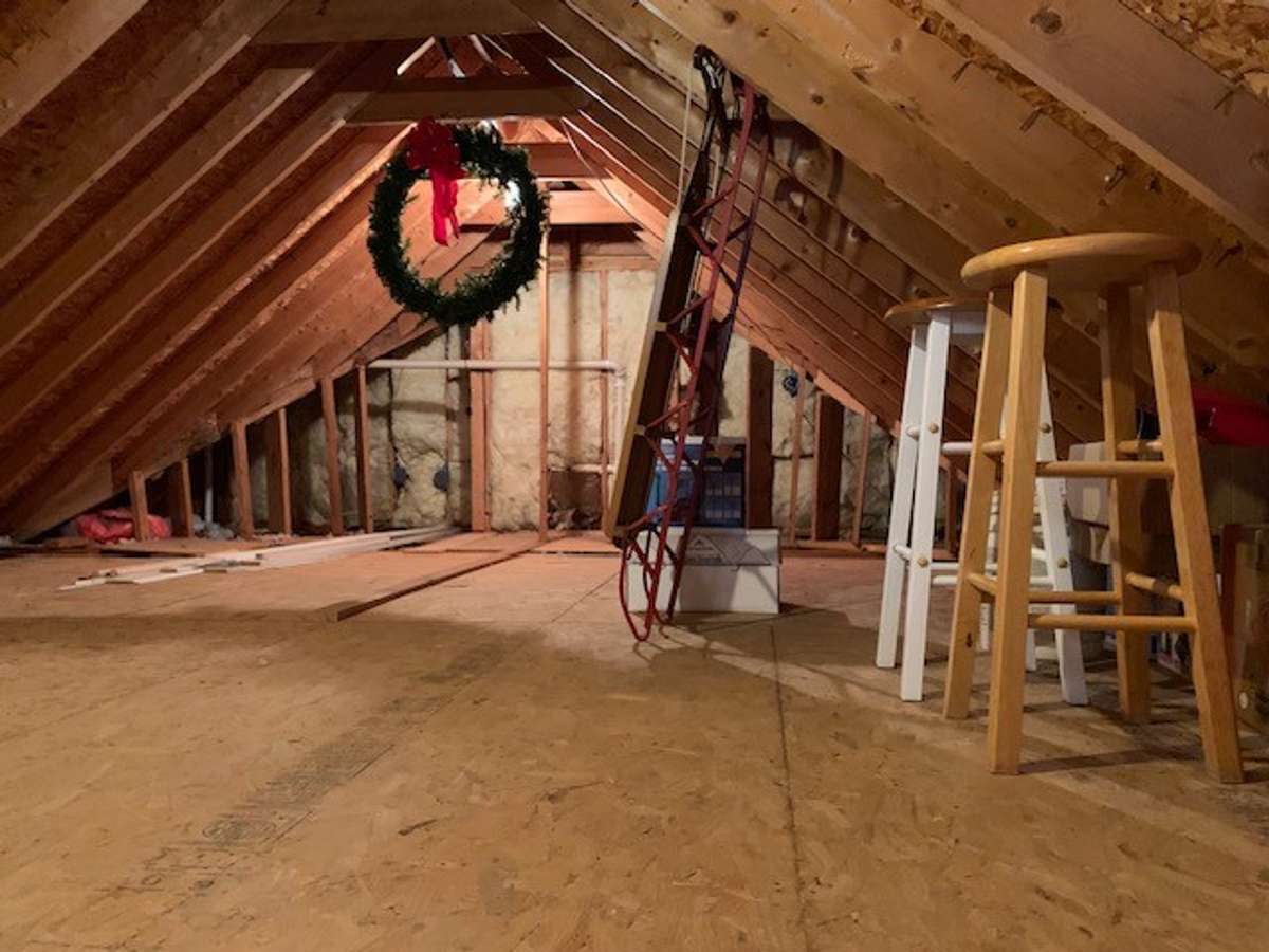 The attic in the garage also offers additional room for seasonal items and organization, making it easy to keep everything neat and accessible.