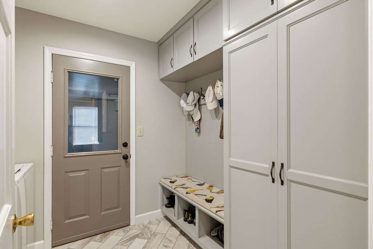 Convenient area for coats and boots coming in from the garage.